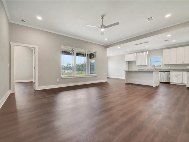 128 Stoney Rdg, Lufkin, TX 75904 - unfurnished living room featuring crown molding, a ceiling fan, dark wood-type flooring, and recessed lighting