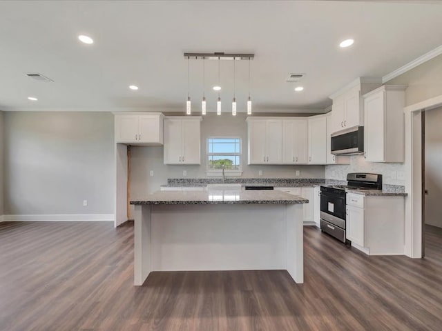 128 Stoney Rdg, Lufkin, TX 75904 - kitchen with stainless steel range with gas stovetop, white cabinetry, a center island, dark wood-style flooring, and stone countertops