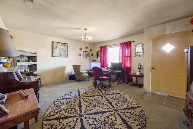 carpeted home office featuring a chandelier