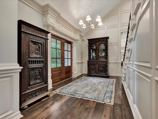 5078 US Highway 21, Nacogdoches, TX 75964 - foyer entrance with a decorative wall, a chandelier, french doors, dark wood-style flooring, and lofted ceiling
