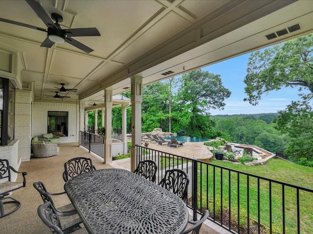 5078 US Highway 21, Nacogdoches, TX 75964 - view of patio / terrace featuring ceiling fan, outdoor dining space, and a forest view
