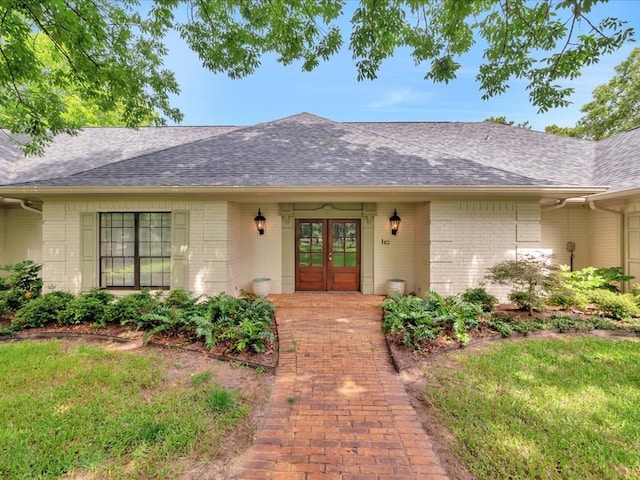 5078 US Highway 21, Nacogdoches, TX 75964 - entrance to property with french doors, brick siding, and roof with shingles