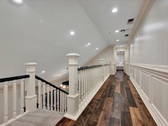 5078 US Highway 21, Nacogdoches, TX 75964 - hallway featuring an upstairs landing, wainscoting, dark wood-type flooring, a decorative wall, and recessed lighting