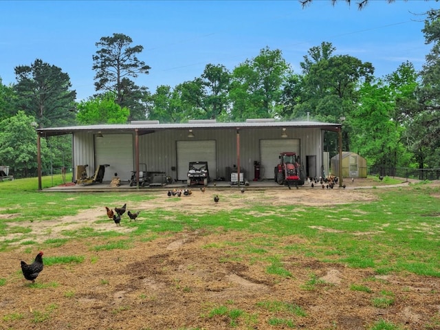 5078 US Highway 21, Nacogdoches, TX 75964 - rear view of house featuring an outbuilding and a garage