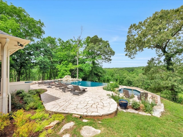 5078 US Highway 21, Nacogdoches, TX 75964 - view of patio / terrace featuring an outdoor pool and a view of trees
