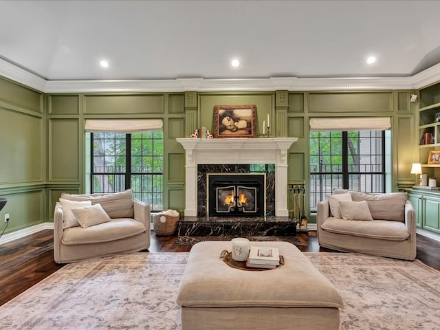 5078 US Highway 21, Nacogdoches, TX 75964 - living room featuring a decorative wall, a high end fireplace, ornamental molding, dark wood-style floors, and recessed lighting