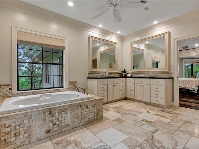 5078 US Highway 21, Nacogdoches, TX 75964 - bathroom with crown molding, double vanity, a ceiling fan, a bath, and recessed lighting