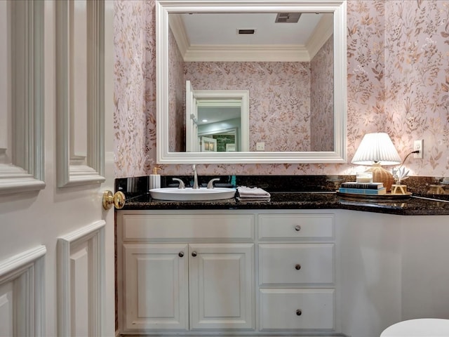 5078 US Highway 21, Nacogdoches, TX 75964 - bathroom featuring wallpapered walls, vanity, toilet, and crown molding