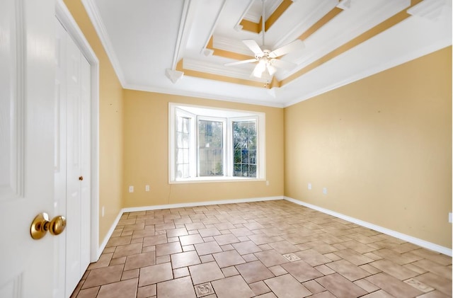 unfurnished room featuring a tray ceiling, ceiling fan, and ornamental molding