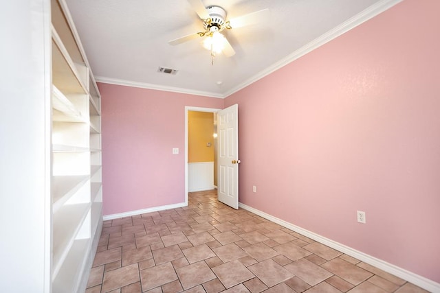 empty room with ceiling fan and crown molding