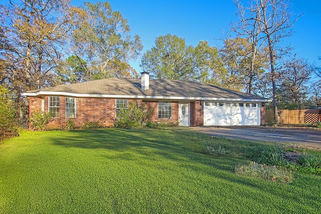 ranch-style house with a front yard and a garage