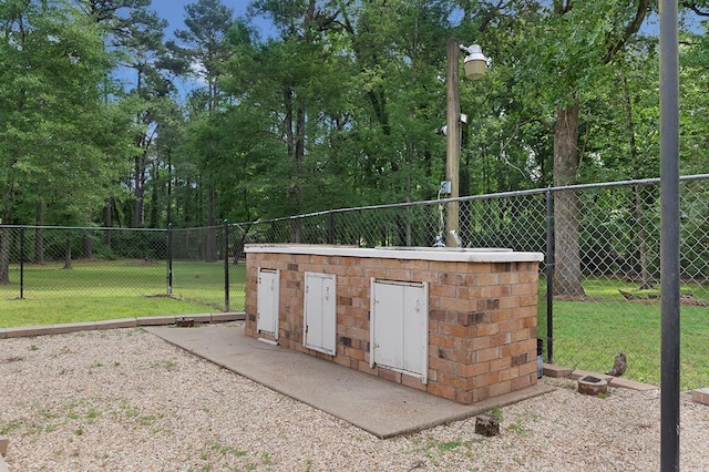 view of outdoor structure featuring fence