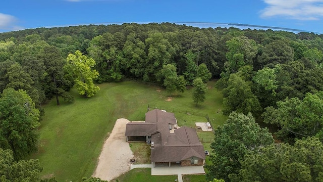 bird's eye view featuring a wooded view