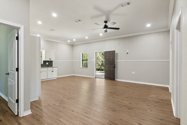 131 Oak Ln, Hemphill, TX 75948 - unfurnished living room with visible vents, crown molding, a ceiling fan, and light wood finished floors