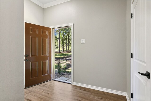 131 Oak Ln, Hemphill, TX 75948 - foyer entrance with baseboards, wood finished floors, and ornamental molding