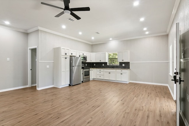 131 Oak Ln, Hemphill, TX 75948 - kitchen with light wood-style flooring, a ceiling fan, white cabinetry, appliances with stainless steel finishes, and decorative backsplash