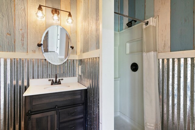 131 Oak Ln, Hemphill, TX 75948 - bathroom with wallpapered walls, vanity, and walk in shower