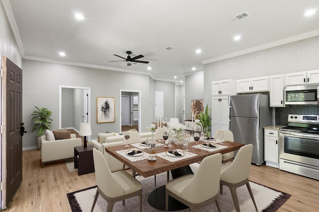 131 Oak Ln, Hemphill, TX 75948 - dining room featuring visible vents, ceiling fan, ornamental molding, recessed lighting, and light wood-style floors