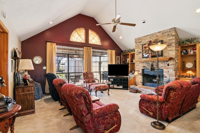 living room featuring light carpet, ceiling fan, a fireplace, and high vaulted ceiling