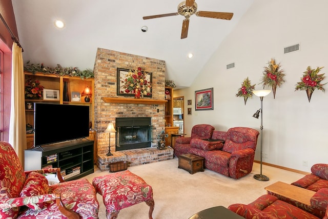 living room featuring high vaulted ceiling, a brick fireplace, ceiling fan, and carpet flooring