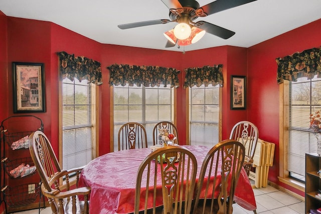 tiled dining space with ceiling fan