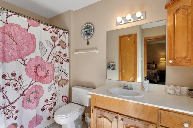 bathroom with toilet and vanity