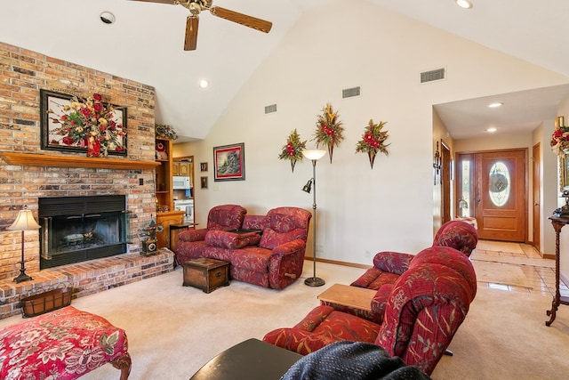 carpeted living room featuring high vaulted ceiling, ceiling fan, and a fireplace