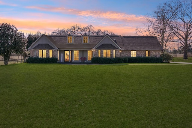 view of front of house with a lawn