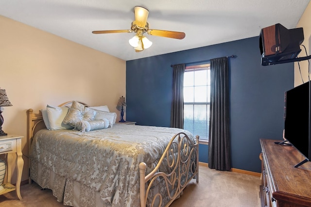 bedroom with ceiling fan and carpet floors