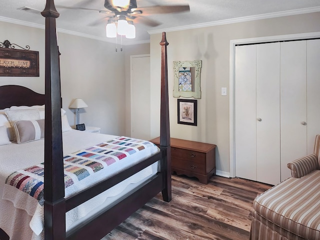 2104 Pinecrest Dr, Jasper, TX 75951 - bedroom with crown molding, dark wood-style flooring, a closet, and ceiling fan