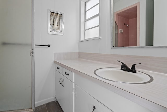 bathroom featuring vanity and walk in shower