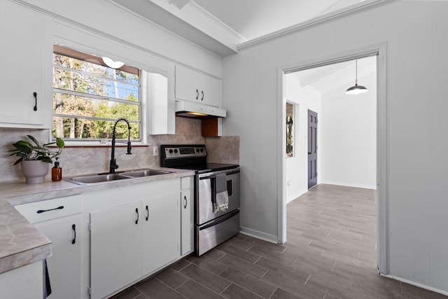 kitchen with white cabinetry, sink, backsplash, stainless steel electric stove, and ornamental molding