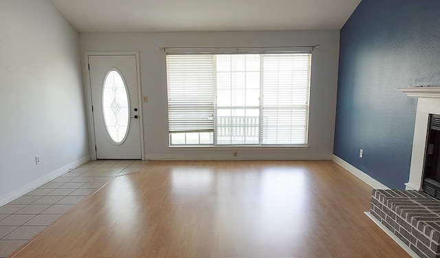 157 Sandalwood, Lufkin, TX 75904 - entrance foyer with healthy amount of natural light, light wood-type flooring, and baseboards