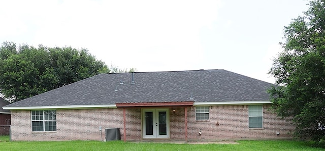 157 Sandalwood, Lufkin, TX 75904 - rear view of house featuring french doors, a shingled roof, a yard, brick siding, and cooling unit