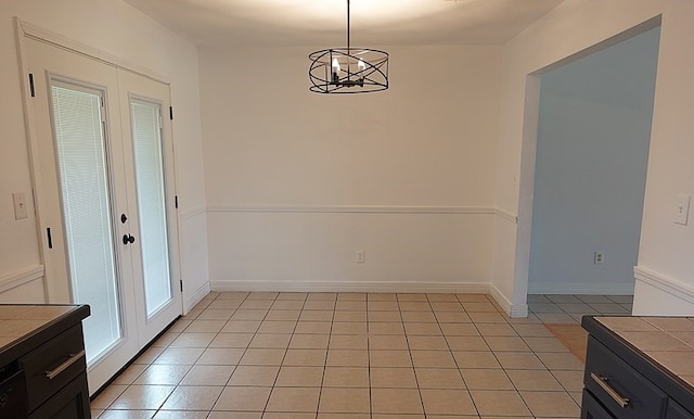 157 Sandalwood, Lufkin, TX 75904 - unfurnished dining area with a chandelier and light tile patterned floors