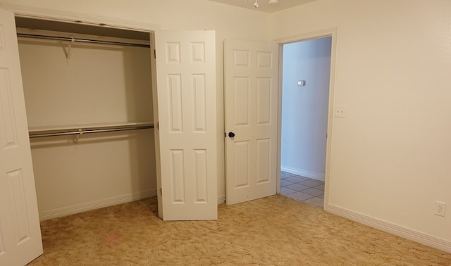 157 Sandalwood, Lufkin, TX 75904 - unfurnished bedroom with carpet floors, a closet, and baseboards