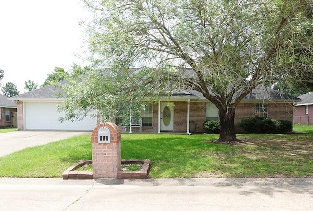 157 Sandalwood, Lufkin, TX 75904 - obstructed view of property with a front lawn, concrete driveway, a garage, and brick siding