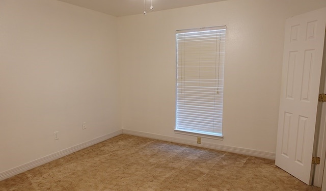 157 Sandalwood, Lufkin, TX 75904 - spare room with light colored carpet, baseboards, and ceiling fan