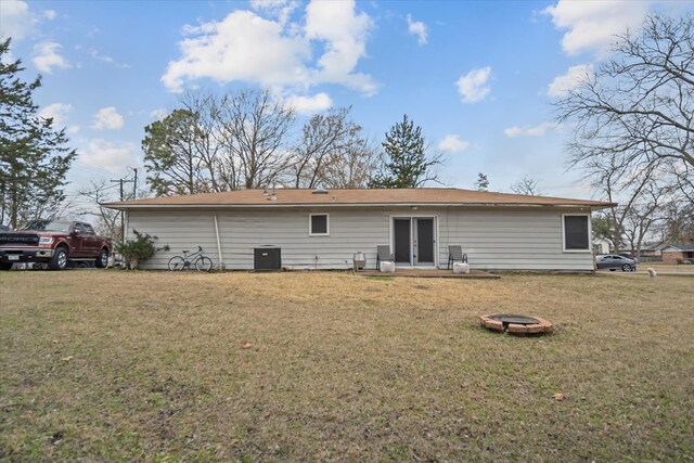 408 Bob St, Lufkin, TX 75904 - rear view of property with a fire pit, a yard, french doors, and central AC