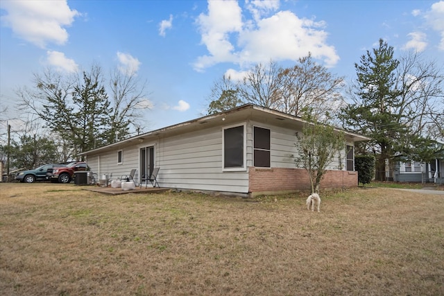 408 Bob St, Lufkin, TX 75904 - view of side of home featuring brick siding and a yard
