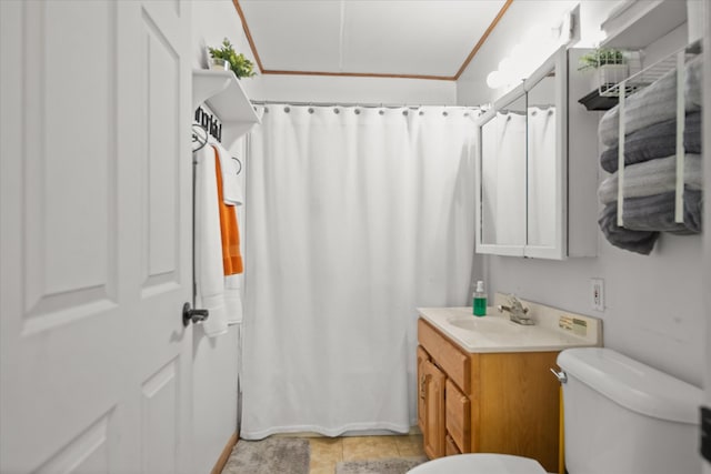 408 Bob St, Lufkin, TX 75904 - bathroom with tile patterned floors, toilet, vanity, crown molding, and a shower with shower curtain