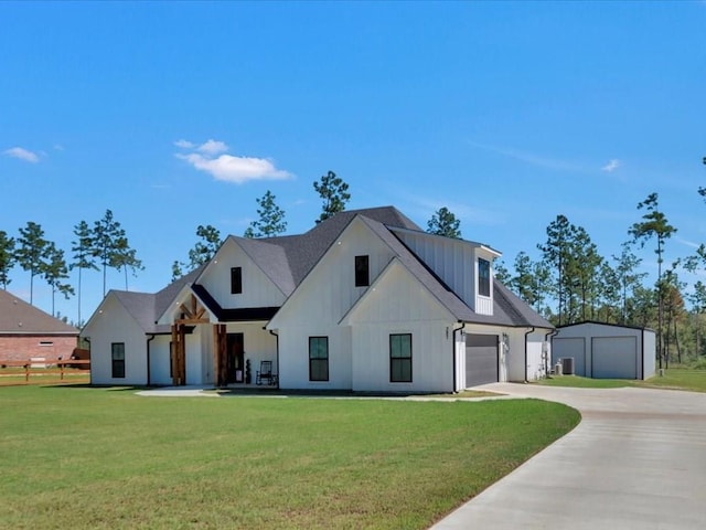 modern farmhouse style home with a front yard