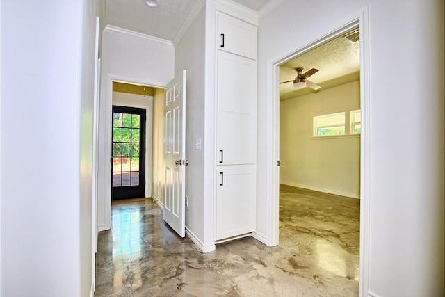 141 Ensign Dr, Hemphill, TX 75948 - corridor with concrete flooring, crown molding, baseboards, and a textured ceiling