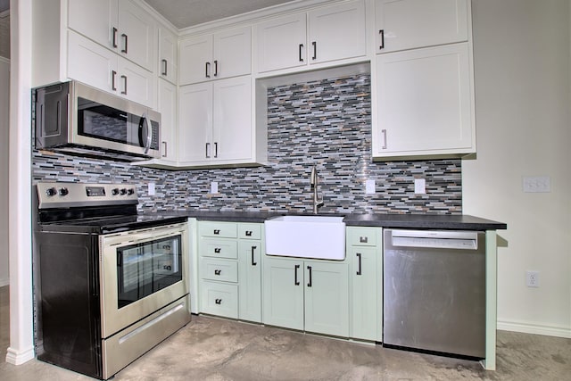 kitchen with decorative backsplash, sink, white cabinets, and appliances with stainless steel finishes