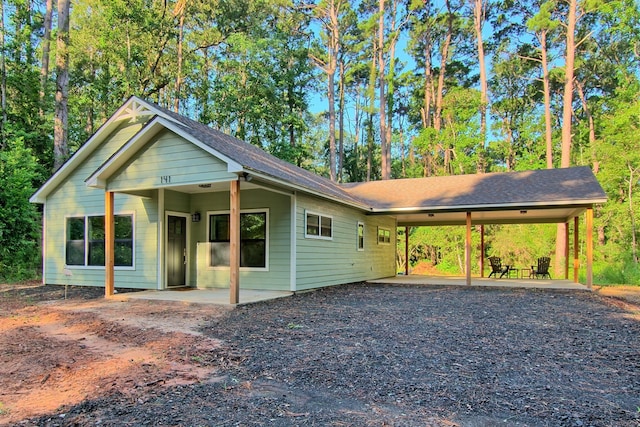 view of front of home featuring a carport