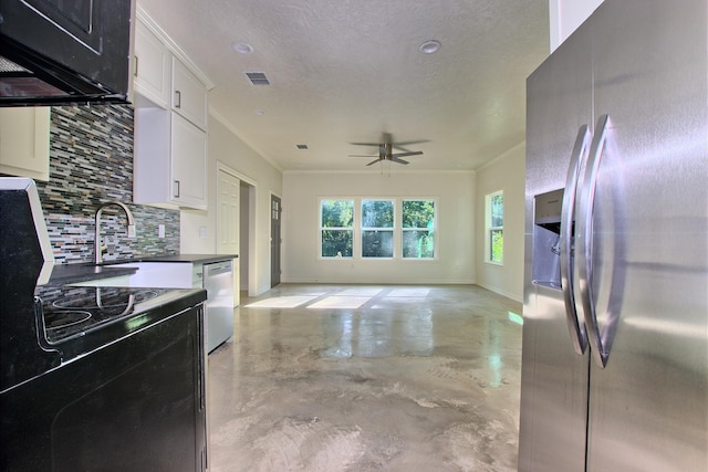 141 Ensign Dr, Hemphill, TX 75948 - kitchen featuring appliances with stainless steel finishes, concrete floors, tasteful backsplash, a sink, and dark countertops