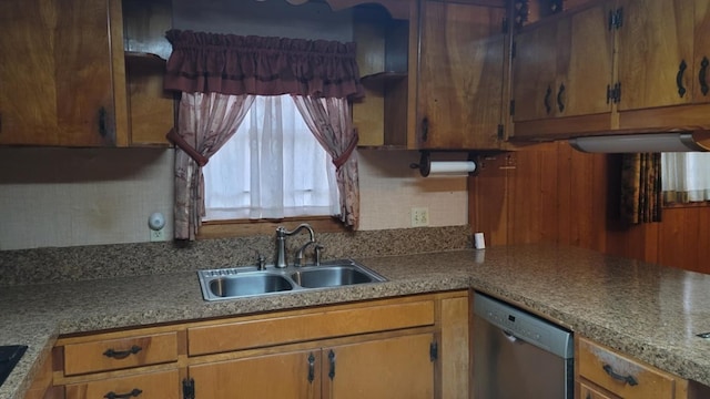 kitchen featuring stainless steel dishwasher and sink