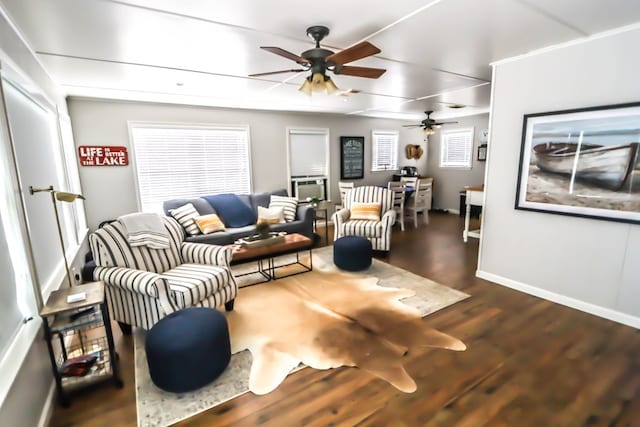 living area featuring baseboards, wood finished floors, and ceiling fan