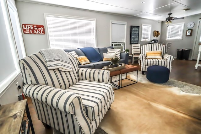 living room with visible vents, cooling unit, and a ceiling fan