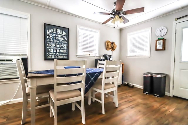 dining area featuring crown molding, baseboards, cooling unit, wood finished floors, and a ceiling fan